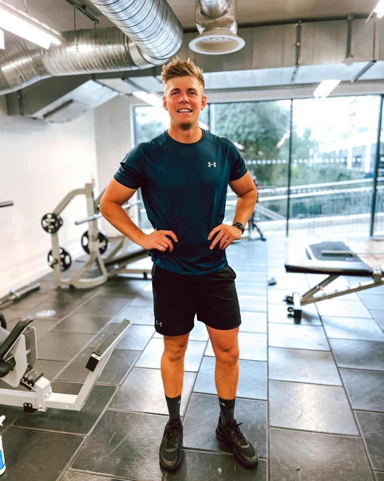 Paddy Watts standing in a gym in training kit