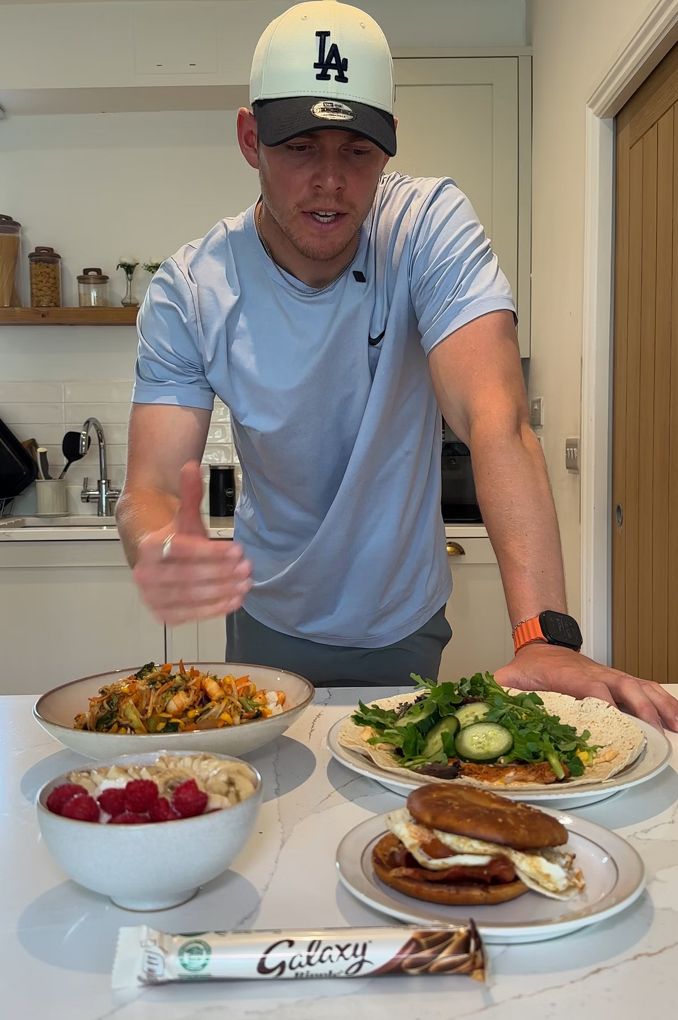 Paddy plating high-protein meals next to a chocolate bar